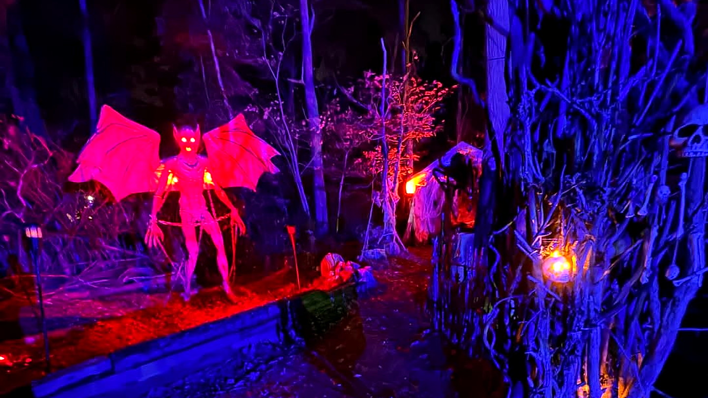 Scare actor in the fog on the night trail